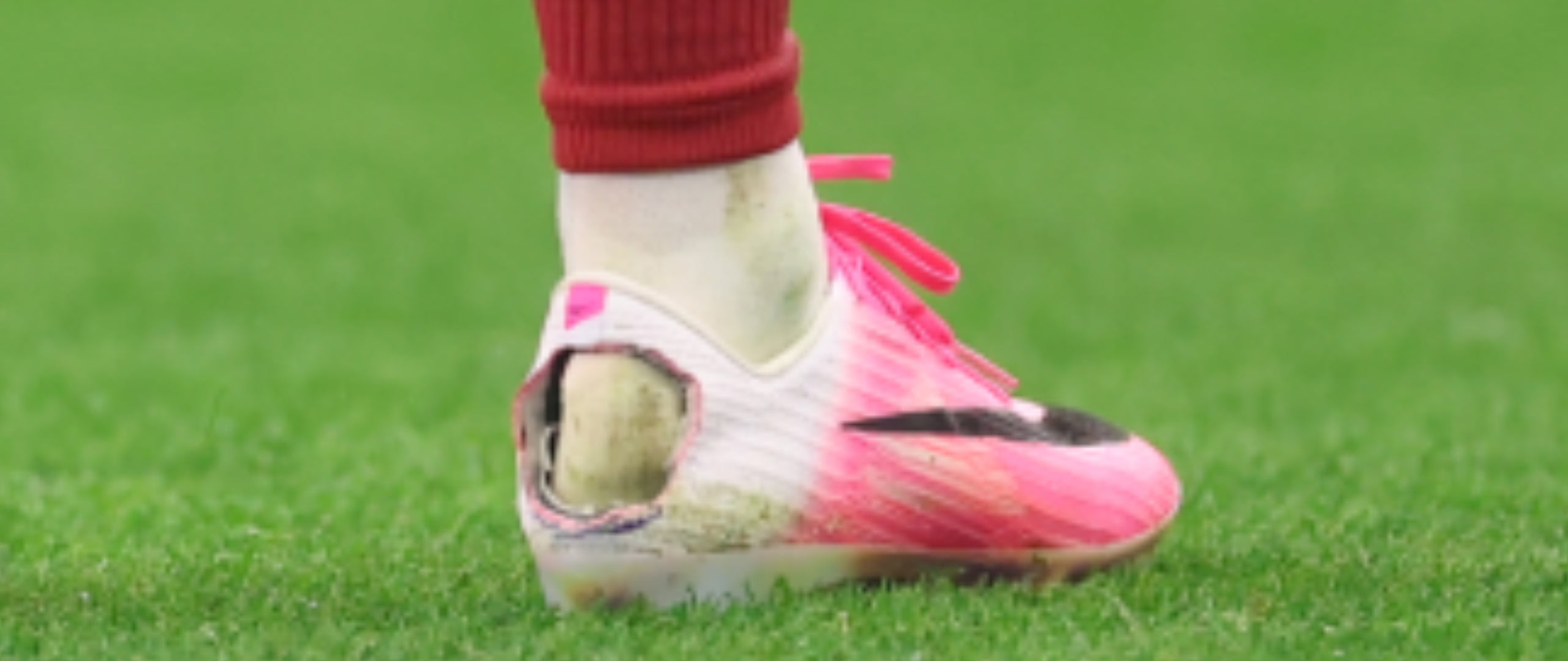Why Do Footballers Cut Holes in Their Boots?