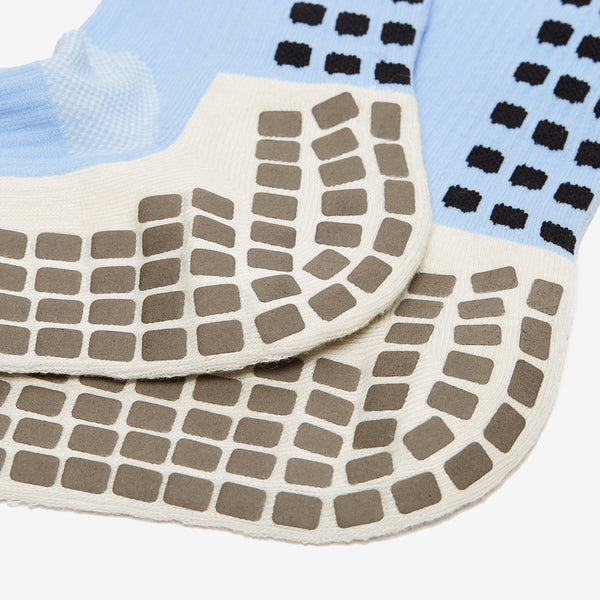 Close-up of textured socks with a grid pattern on a white background