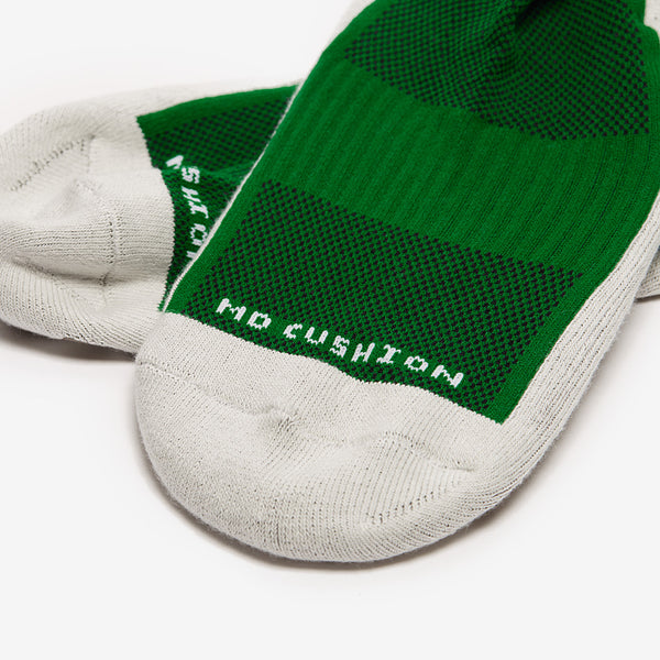 Green and gray cushion socks on a white background