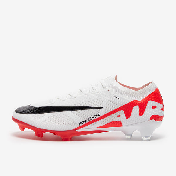 White nike football boot with black and red accents on a white background