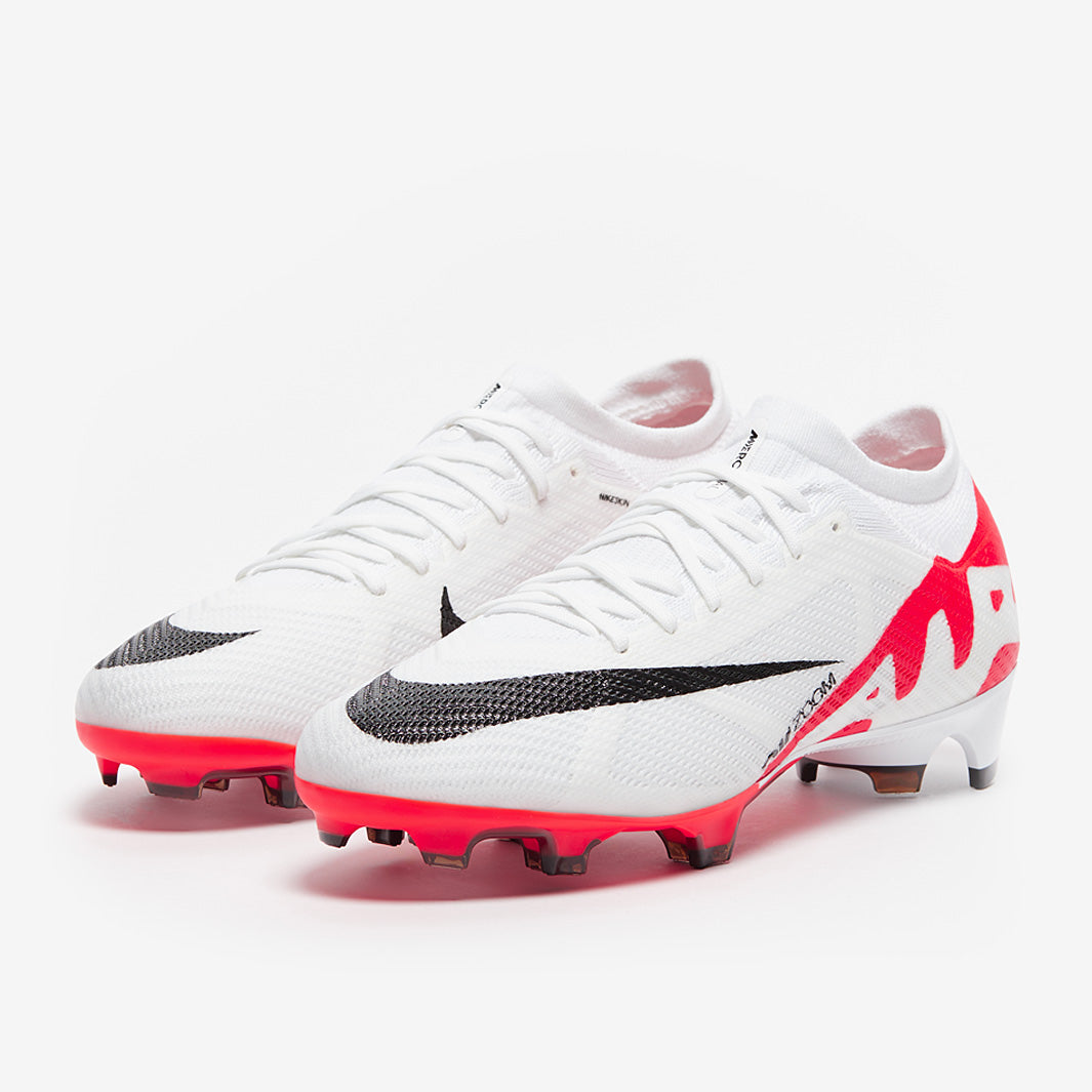White football boots with red and black accents on a white background