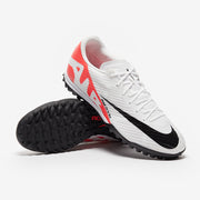 White football shoes with black and red accents on a white background