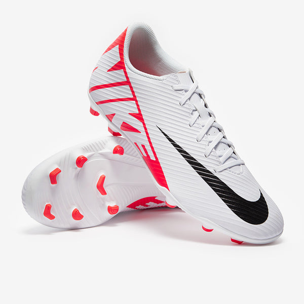 White football boots with red accents and a black swoosh logo on a white background