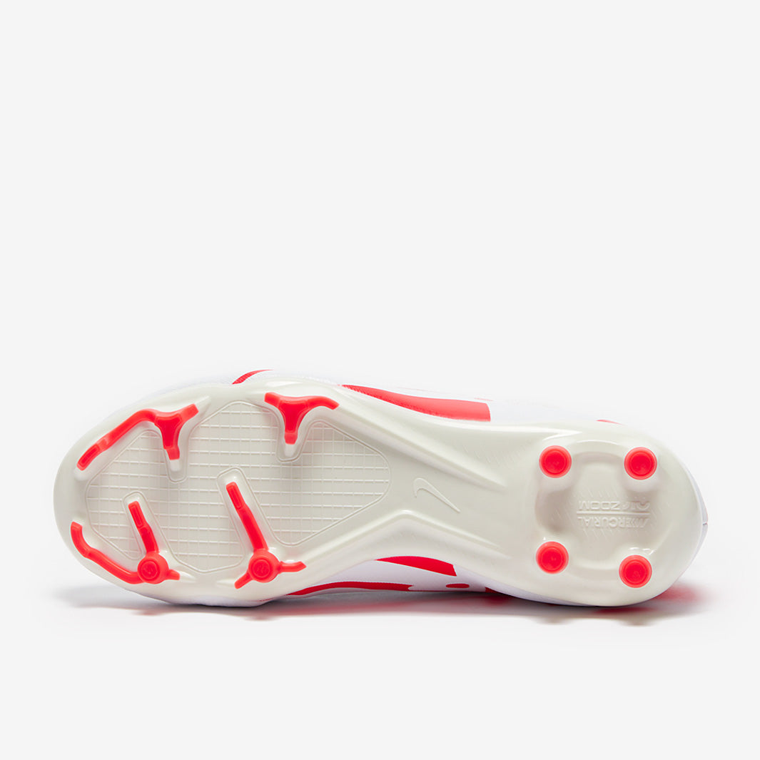 White athletic shoe with red accents on a white background