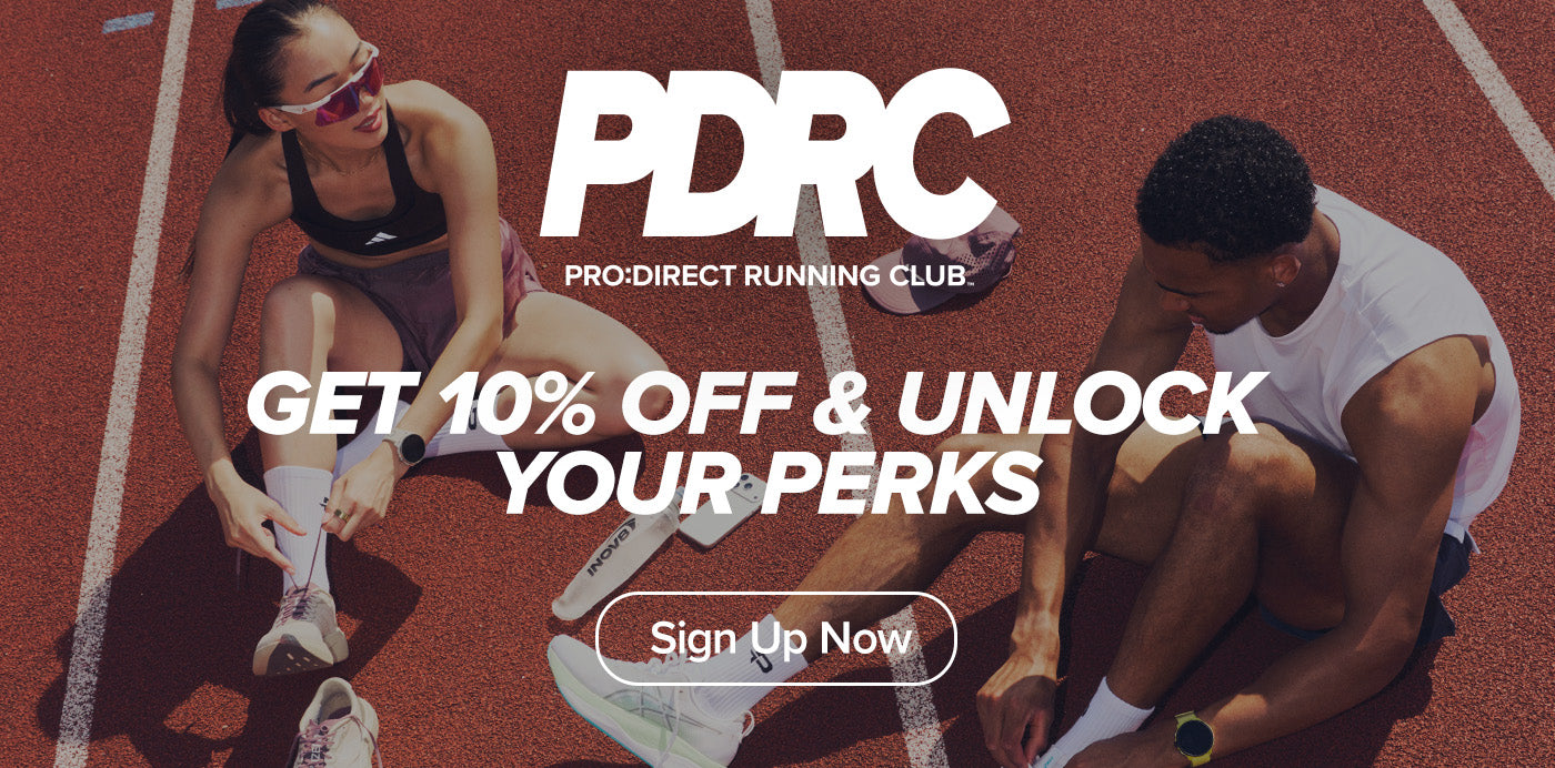 Promotional banner for PDRC (Pro:Direct Running Club) featuring two athletes sitting on a red running track, with large white text reading 'PDRC', 'GET 10% OFF & UNLOCK YOUR PERKS', and a 'Sign Up Now' button.