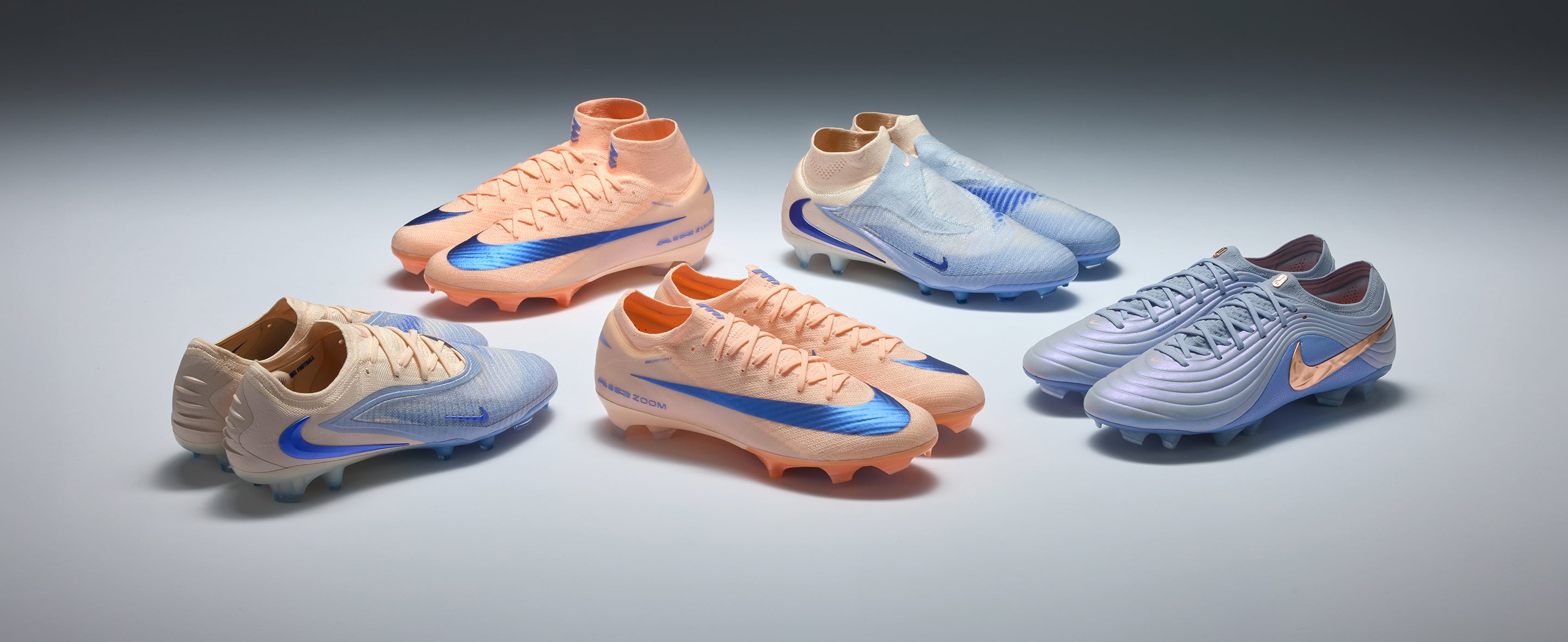 coral nike boots on white background
